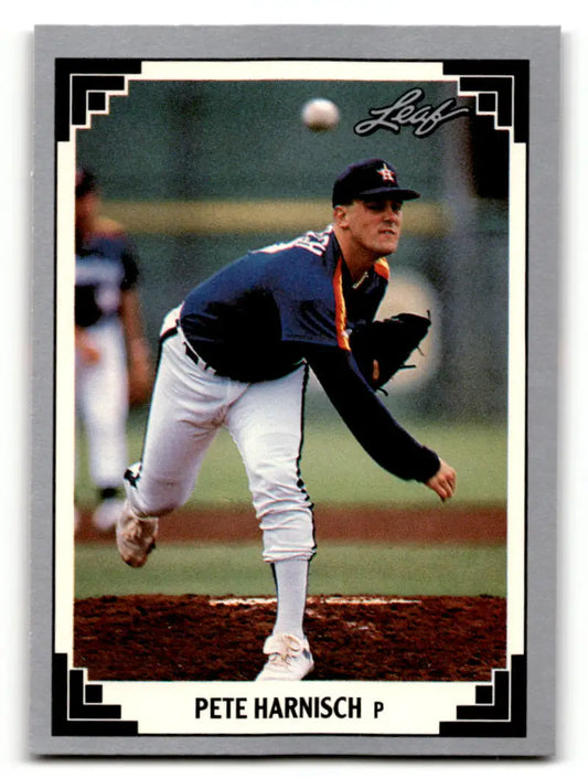 Baseball card of Pete Harnisch mid-delivery in navy Houston Astros uniform