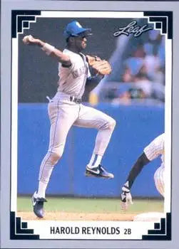 Baseball card of Harold Reynolds leaping throw in Seattle Mariners uniform