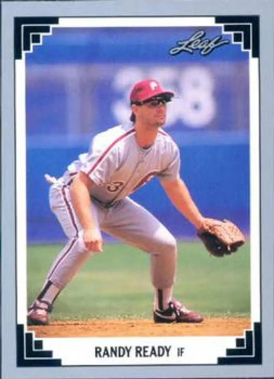 Baseball player in a white uniform crouched in fielding stance on Randy Ready baseball card