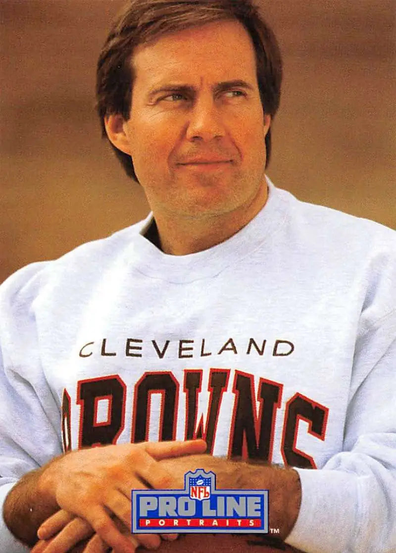 Person in a white Cleveland Browns sweatshirt next to a Pro Line Portraits rookie card