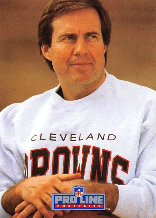 Person in a white Cleveland Browns sweatshirt next to a Pro Line Portraits rookie card