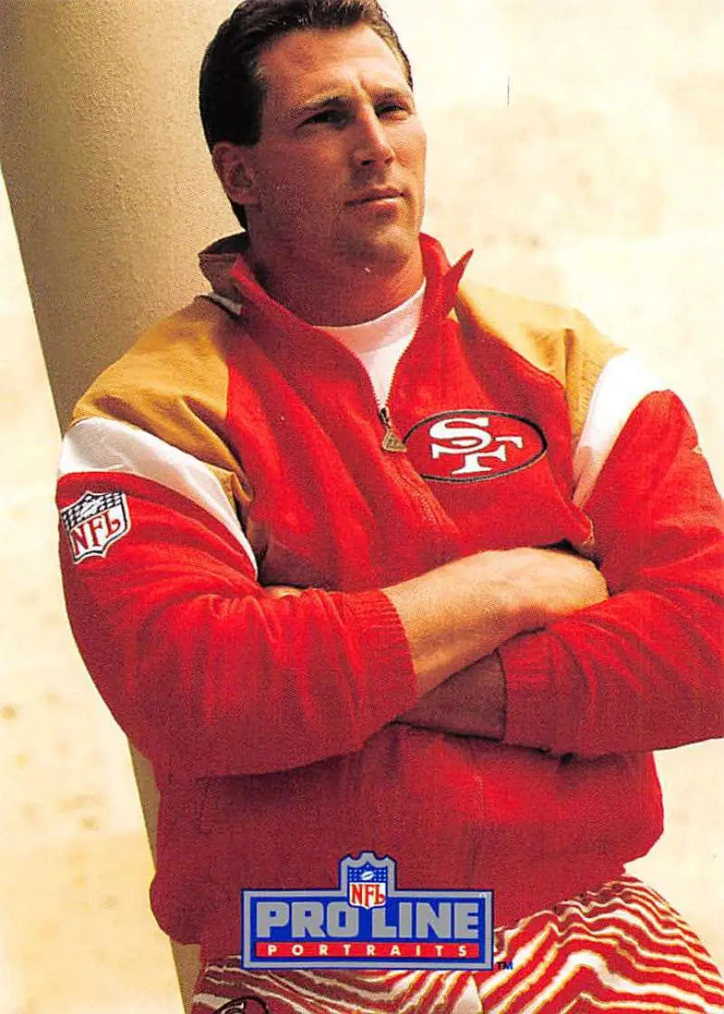 Person in red and yellow San Francisco 49ers jacket with arms crossed, featuring Pierce Holt