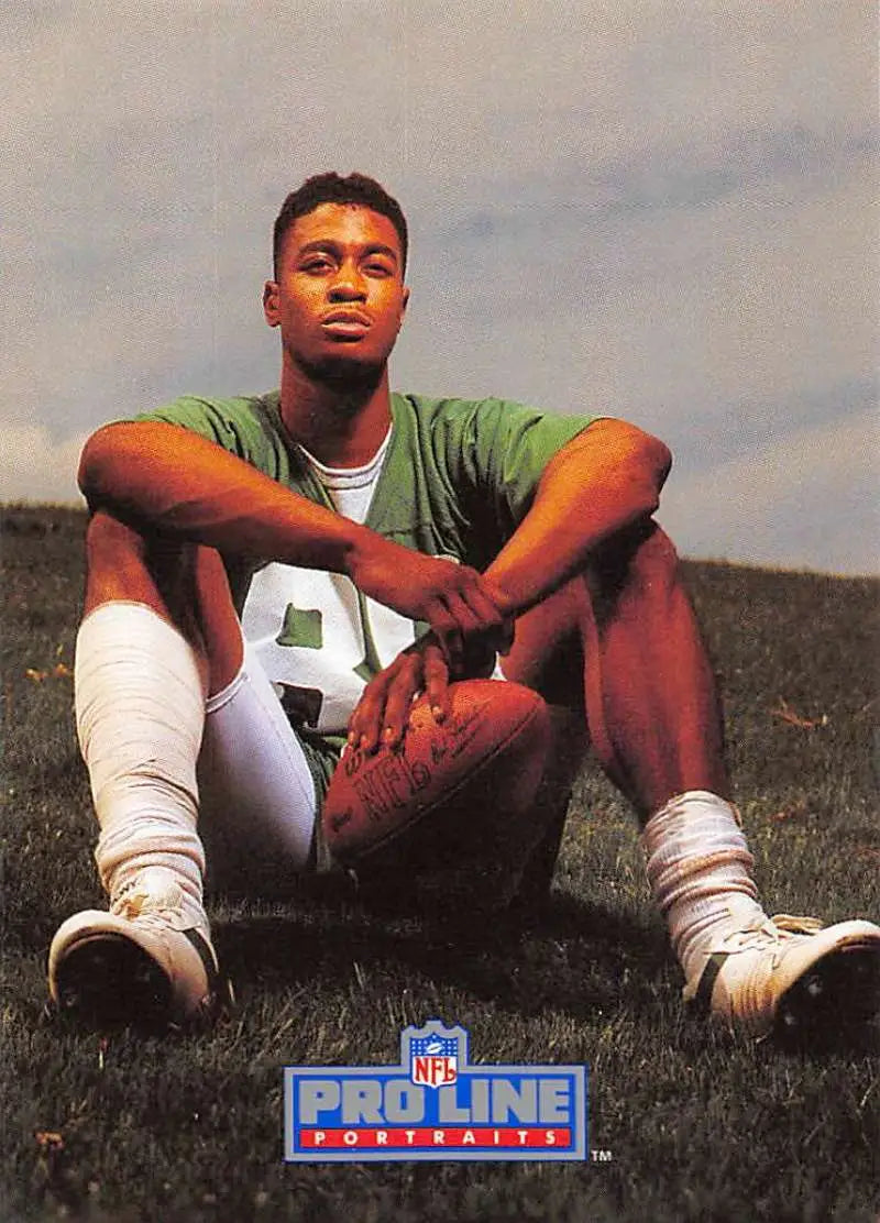 Rob Moore in a green jersey with a football from Pro Line Portraits football card