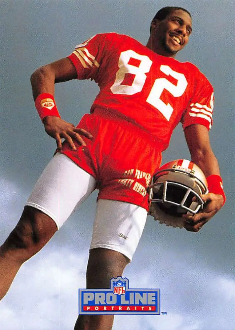 Football player in red #82 jersey holding a football for San Francisco 49ers John Taylor card