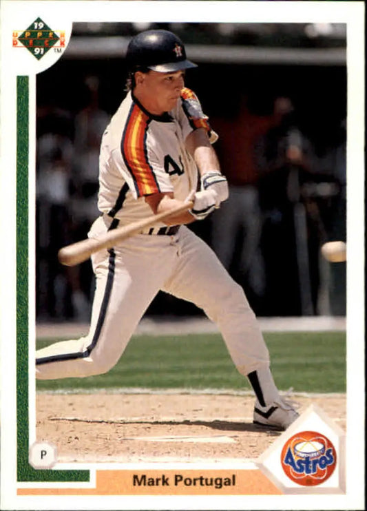 Baseball player Mark Portugal swinging bat in Houston Astros uniform baseball card