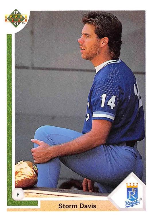 Baseball player in a blue Kansas City Royals uniform number 14 on a trading card