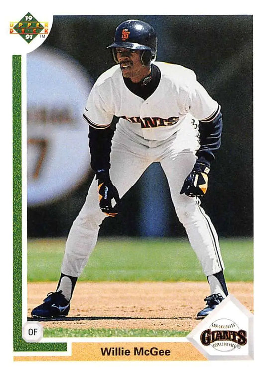 Willie McGee in white San Francisco Giants uniform taking lead off base