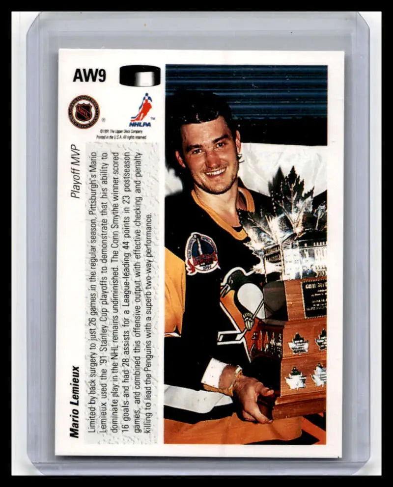 Hockey trading card of Mario Lemieux in black and yellow jersey by Upper Deck AW9