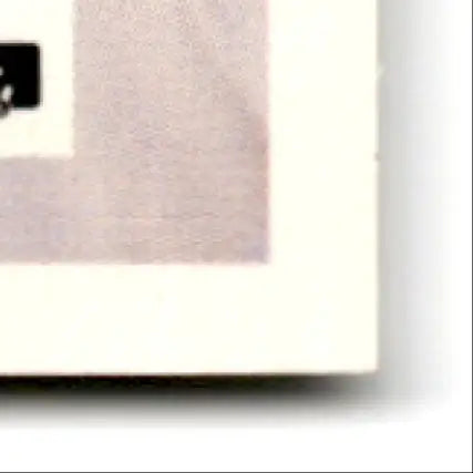 Close-up of a corner of Fleer Football Steve Young #386 card with discolored border
