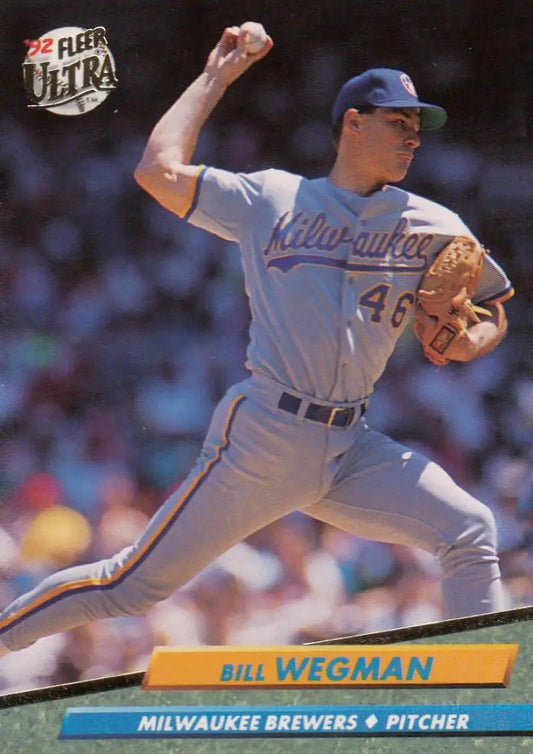Baseball card of Milwaukee Brewers pitcher Bill Wegman in mid-throwing action