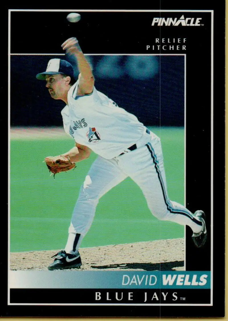 Baseball card of David Wells pitching for the Toronto Blue Jays in white uniform