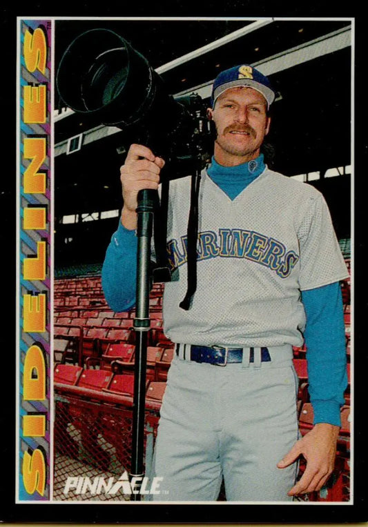 Randy Johnson in Seattle Mariners uniform holding a camera on baseball card