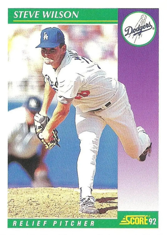 Baseball card of Steve Wilson, Los Angeles Dodgers relief pitcher mid-pitch in home uniform