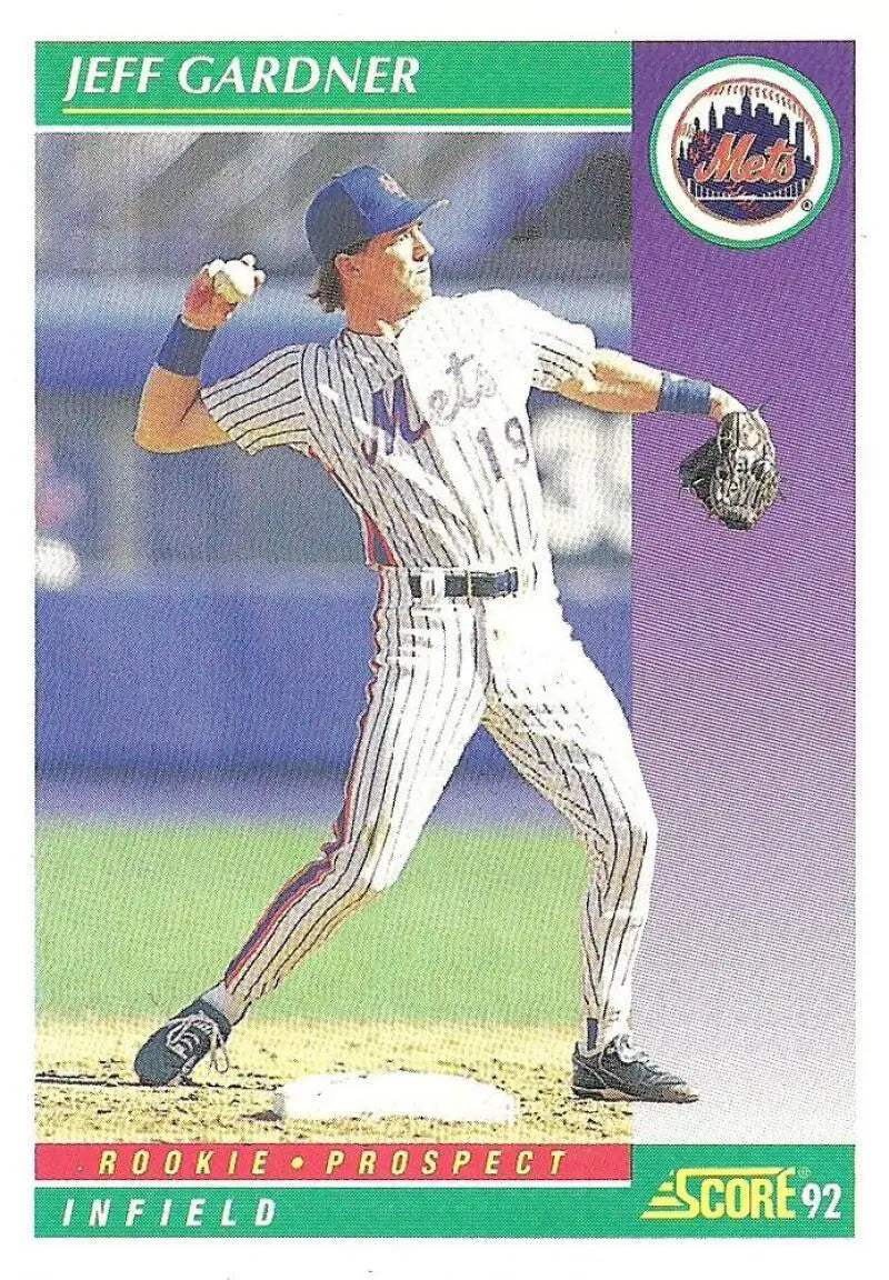 Baseball player Jeff Gardner in New York Mets pinstripe uniform throwing ball