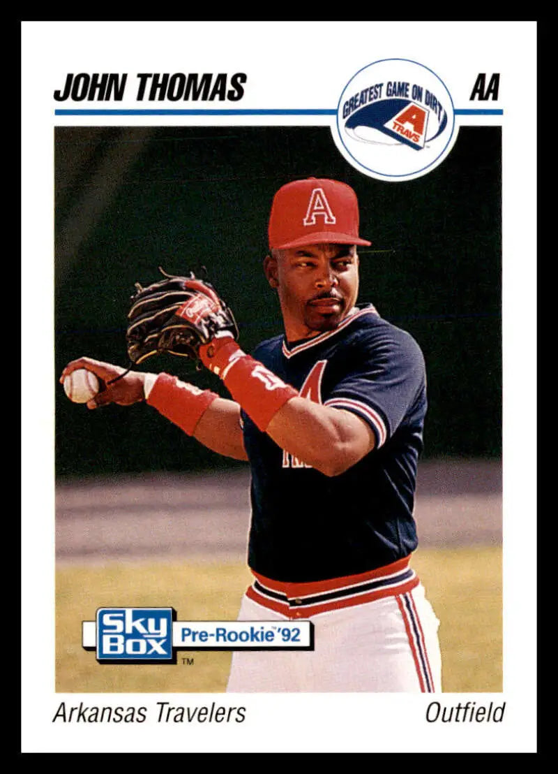 Baseball card of John Thomas, Arkansas Travelers outfielder in navy and red uniform