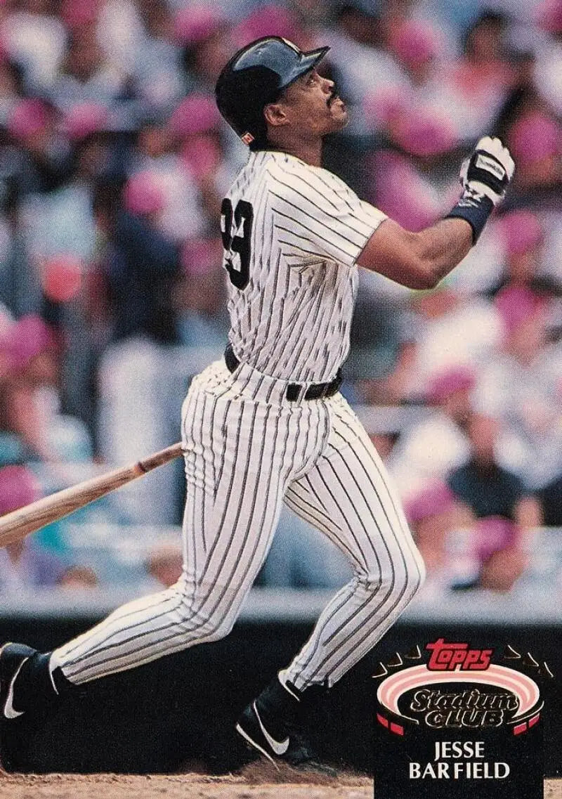 Jesse Barfield swinging a bat in a New York Yankees pinstriped uniform on Topps Stadium Club card