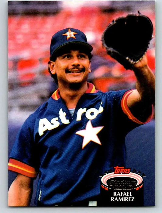 Baseball player in Houston Astros jersey showcasing 1992 Topps Stadium Club Rafael Ramirez card