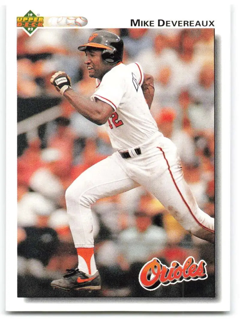 Baseball player in white Baltimore Orioles uniform swings bat for Upper Deck Mike Devereaux