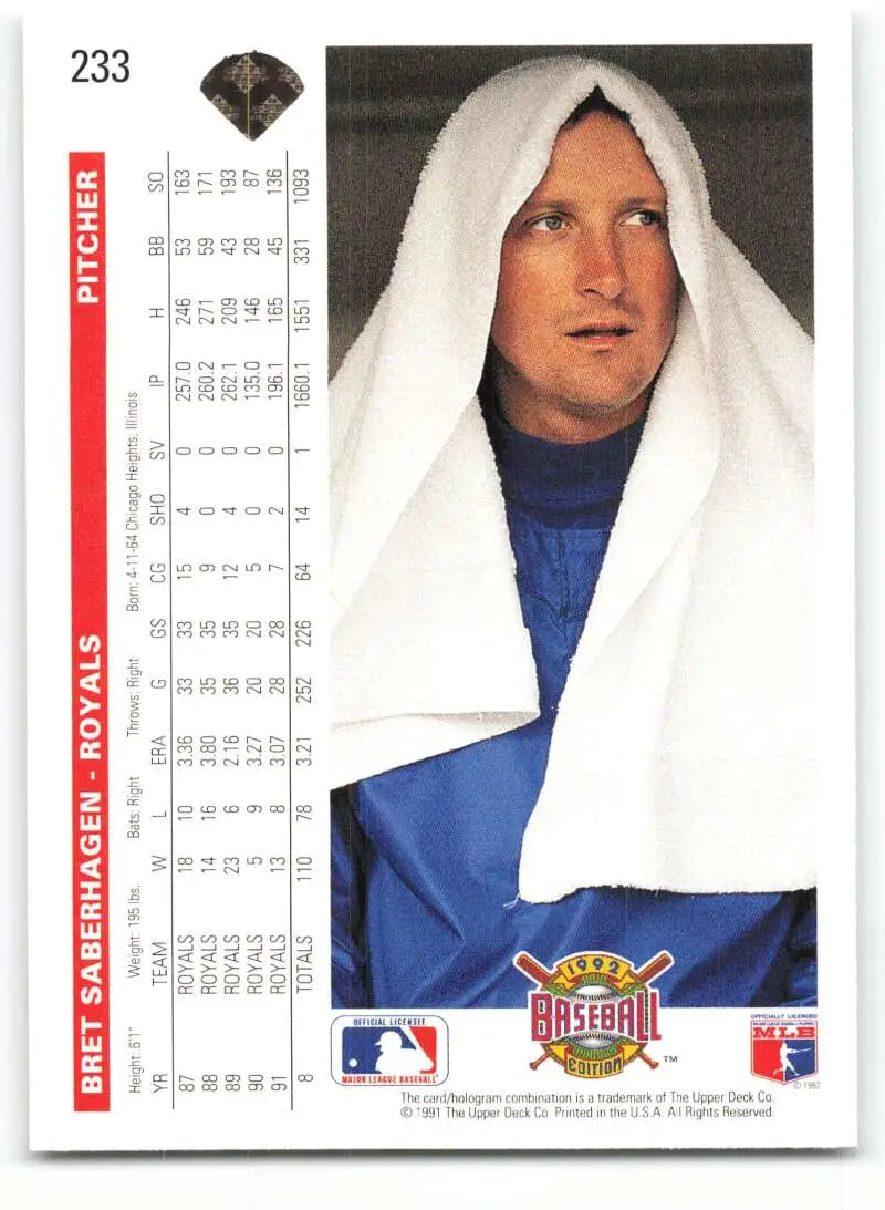 Baseball player in blue uniform with towel, featuring Bret Saberhagen Kansas City Royals