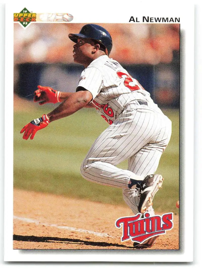 Baseball player sliding into base in Minnesota Twins uniform on Upper Deck card