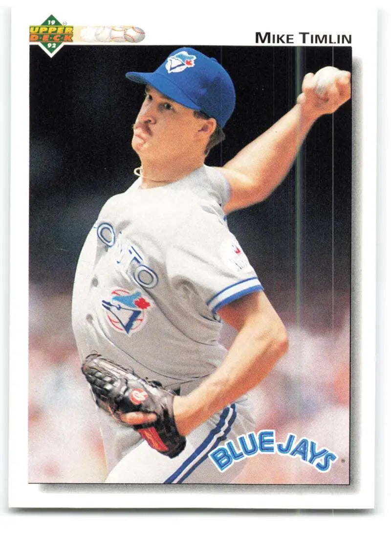 Toronto Blue Jays pitcher Mike Timlin in mid-throw wearing white uniform baseball card