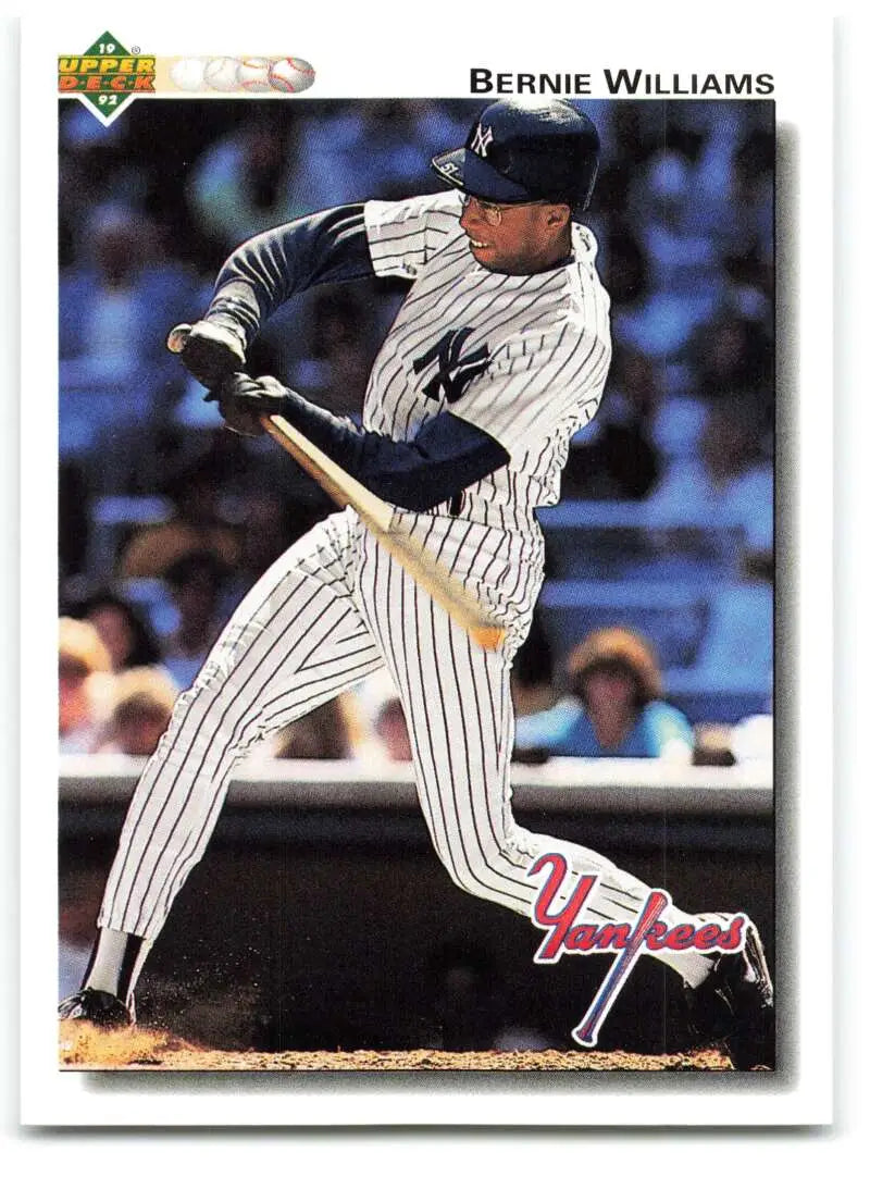 Baseball player in New York Yankees uniform swinging bat on Bernie Williams card