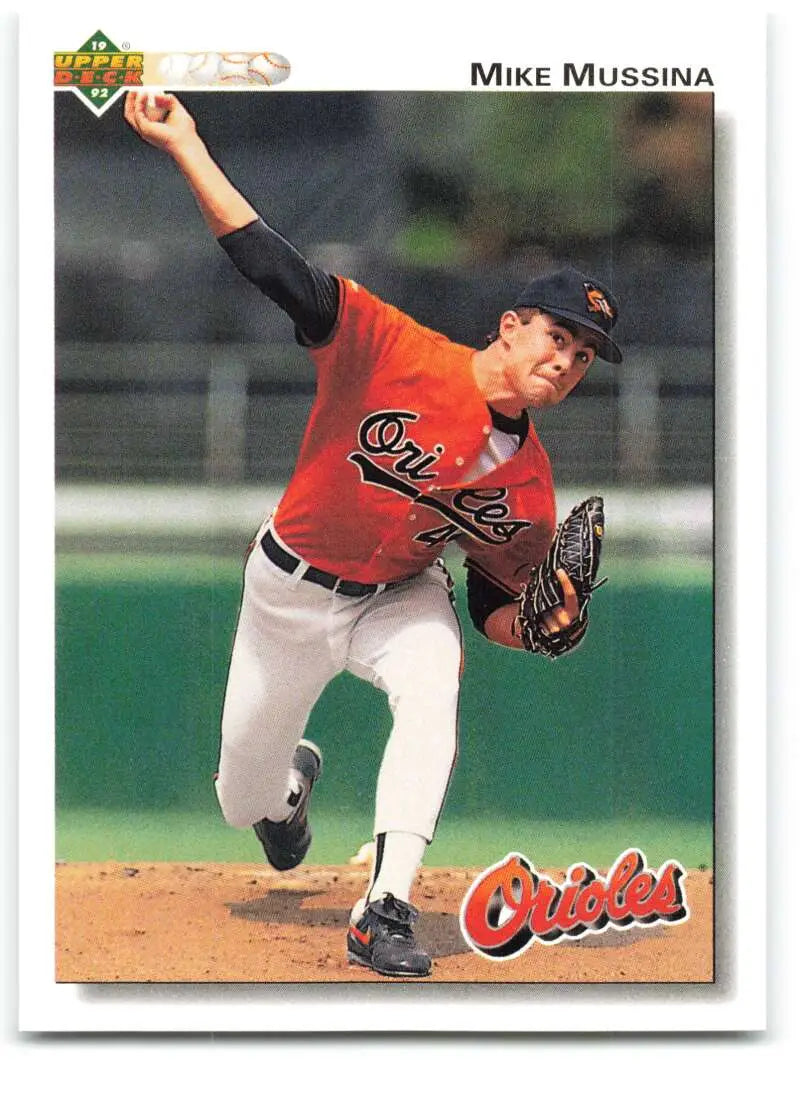 Baltimore Orioles pitcher Mike Mussina delivering in orange jersey on 1992 Upper Deck card
