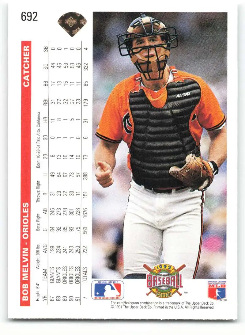 Baseball catcher in orange jersey and black gear on 1992 Upper Deck Bob Melvin card