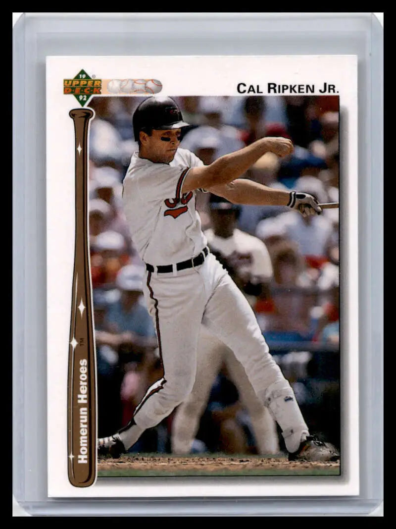 Cal Ripken Jr. mid-swing in a white uniform on a Baltimore Orioles baseball card