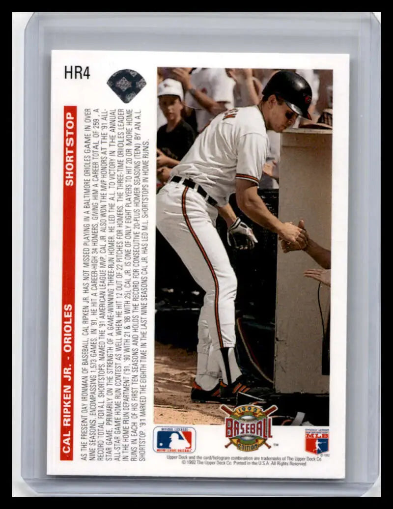 Cal Ripken Jr. Baltimore Orioles baseball card in a dugout, white uniform with black trim