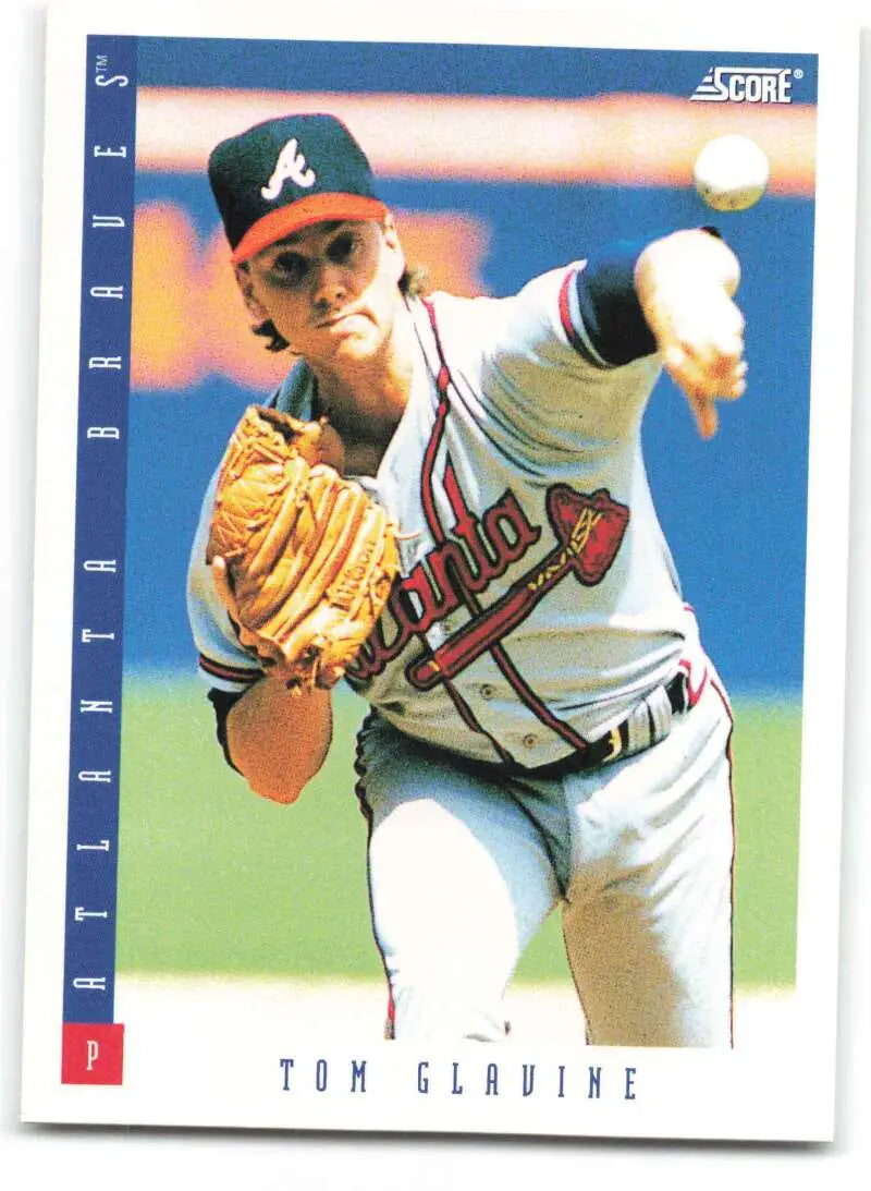 Baseball card of Tom Glavine mid-throw for the Atlanta Braves in NM-MT condition