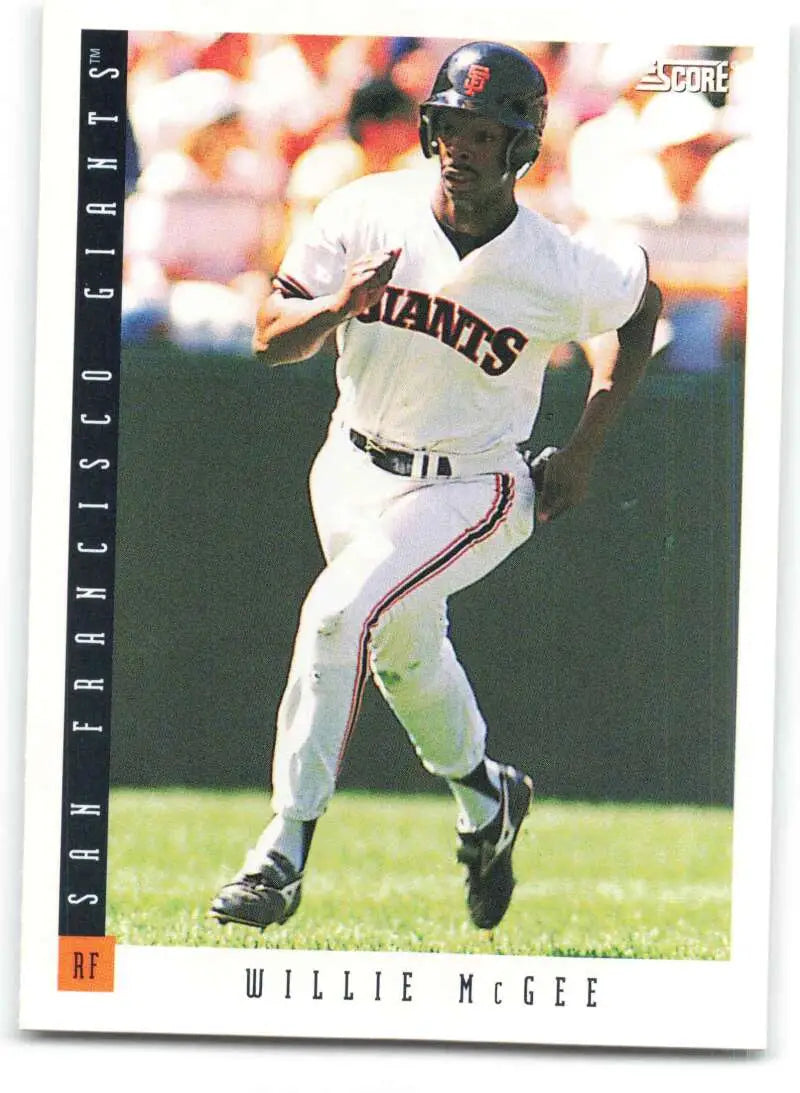 Willie McGee running in a white uniform on a San Francisco Giants baseball card