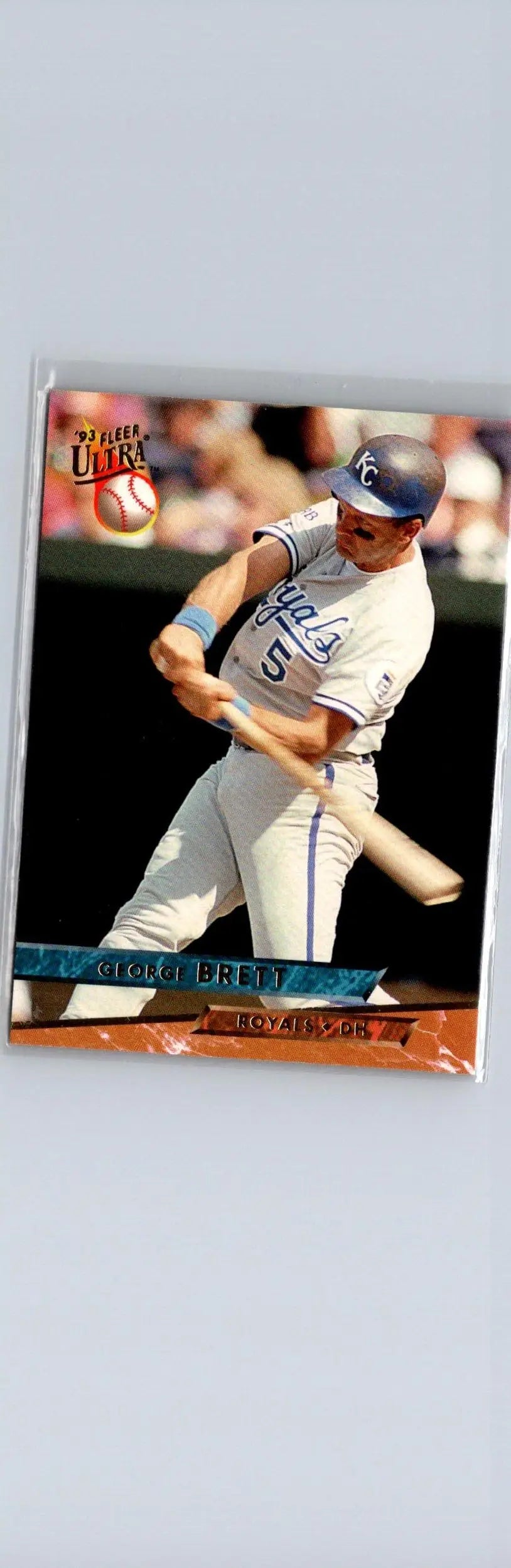 Baseball trading card featuring George Brett from Kansas City Royals in mid-swing