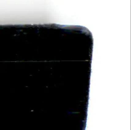 Dark velvety rectangular object with rounded corner, related to action packed football Monday night
