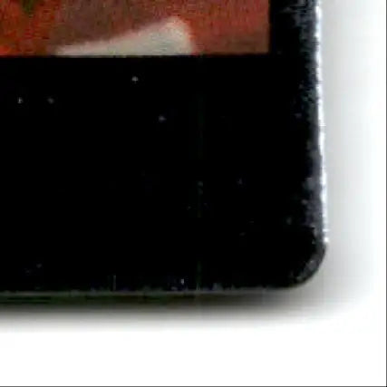 Bottom right corner of black football card with edge wear from 1994 Action Packed Football Monday Night Steve Young San Francisco 49ers