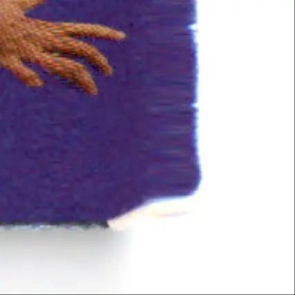 Embroidered brown fingers on purple fabric swatch for action packed football Monday Night Steve Young
