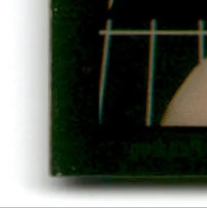 Dark green rectangular object with grid pattern and curved shape in 1994 Collector’s Edge Steve Young Boss Squad Silver 49ers