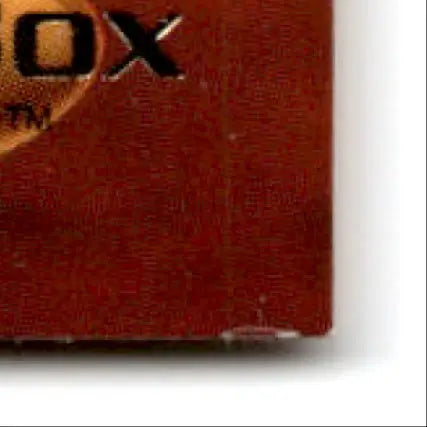 Corner of a red-brown textured Skybox Football Premium box with partial TM and OX logos