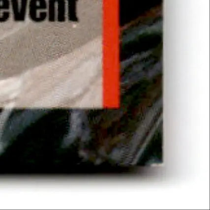 Partially visible book with dark cover and orange spine for 1995 Finish Line Geoff Bodine