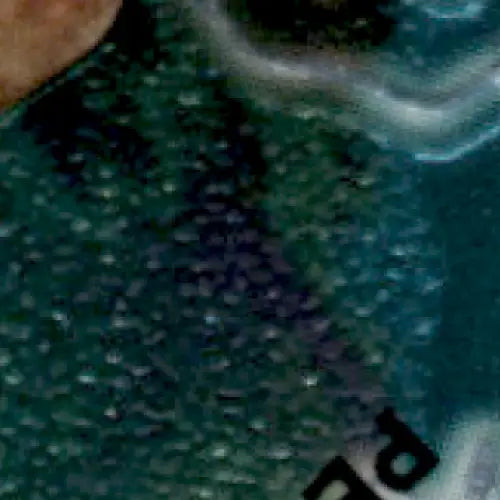 Speckled dark teal wavy-textured surface from 1995 Topps Football Finest Steve Young card