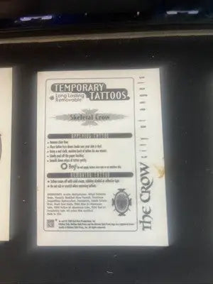 Temporary tattoo instructions featuring a skeletal crow by Kitchen Sink Press for The Crow City of Angels