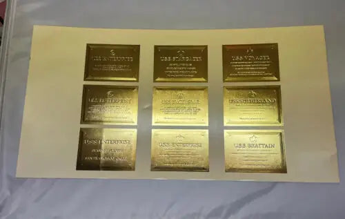 Gold-colored commemorative plaques from 1996 Star Trek Uncut Sheet trading cards