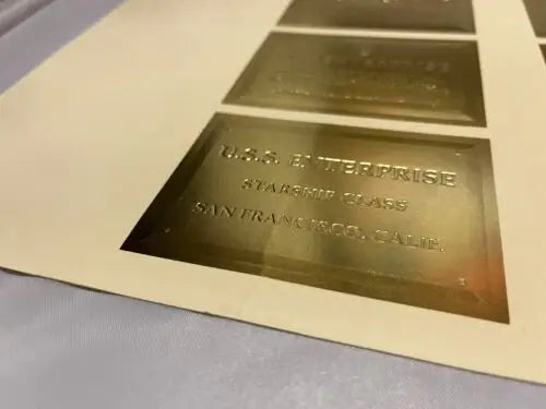 Gold-colored plaque from 1996 Star Trek Uncut Sheet of 9 Gold Foil Trading Cards
