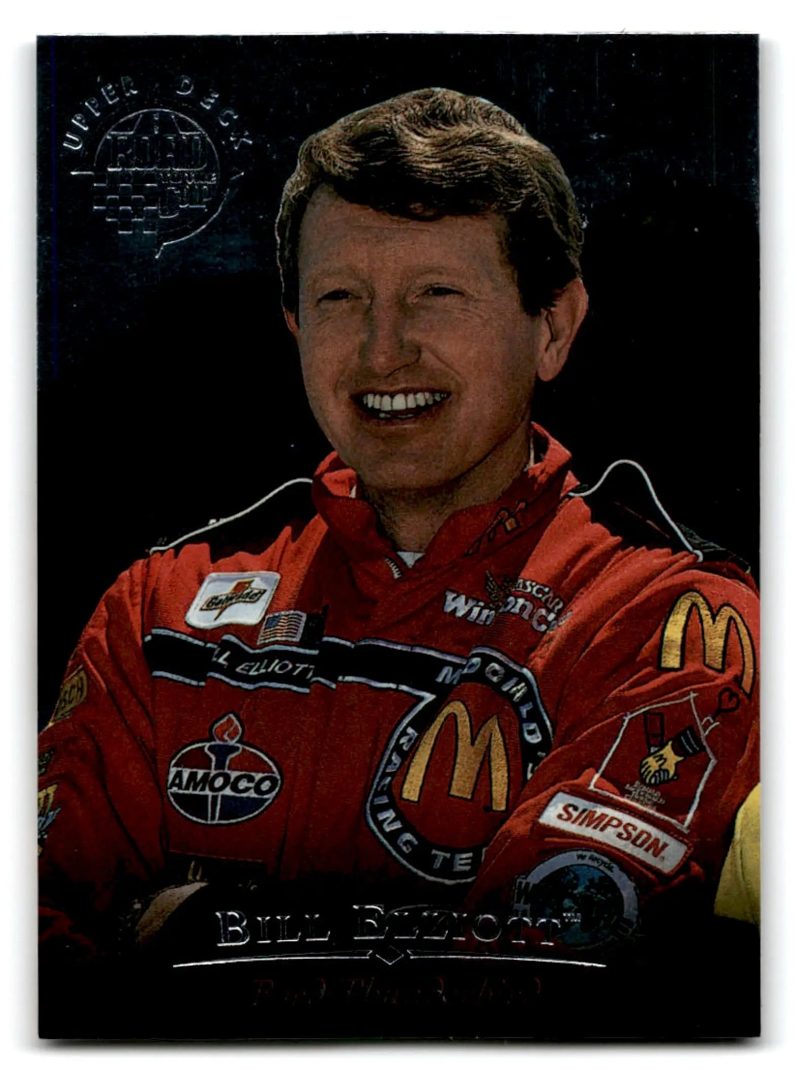 Smiling man in red racing suit from 1996 Upper Deck Racing Road to the Cup Bill Elliott #RC7a