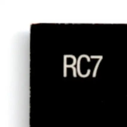 Black rectangular object with RC7 text from 1996 Upper Deck Racing Road to the Cup