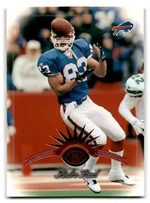 Football player in action featured in 1997 Leaf #37 Andre Reed trading card