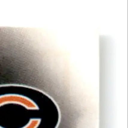 Metallic object with orange and black C logo on 1997 Leaf Bobby Engram Chicago Bears card