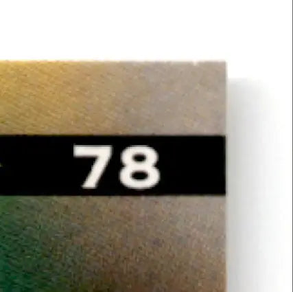 Metal sample with numbered label from Leaf Football Eric Moulds #78 Buffalo Bills