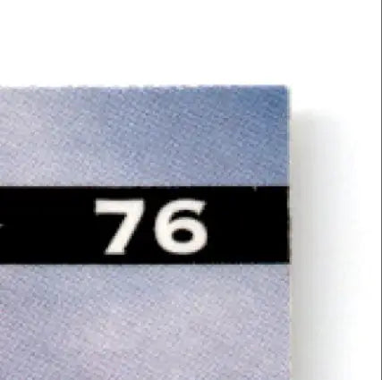 Light blue leaf football swatch with black strip displaying 76 for Muhsin Muhammad Carolina Panthers