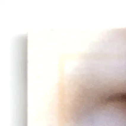 Close-up of a person’s eye with a Leaf Football Vinny Testaverde #40 Baltimore Ravens jersey